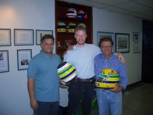 Sid Mosca, James Penrose, Alan Mosca with one of the two 1995 Brasil GP Rubens Barrichello helmets and one of Ayrton’s helmets.